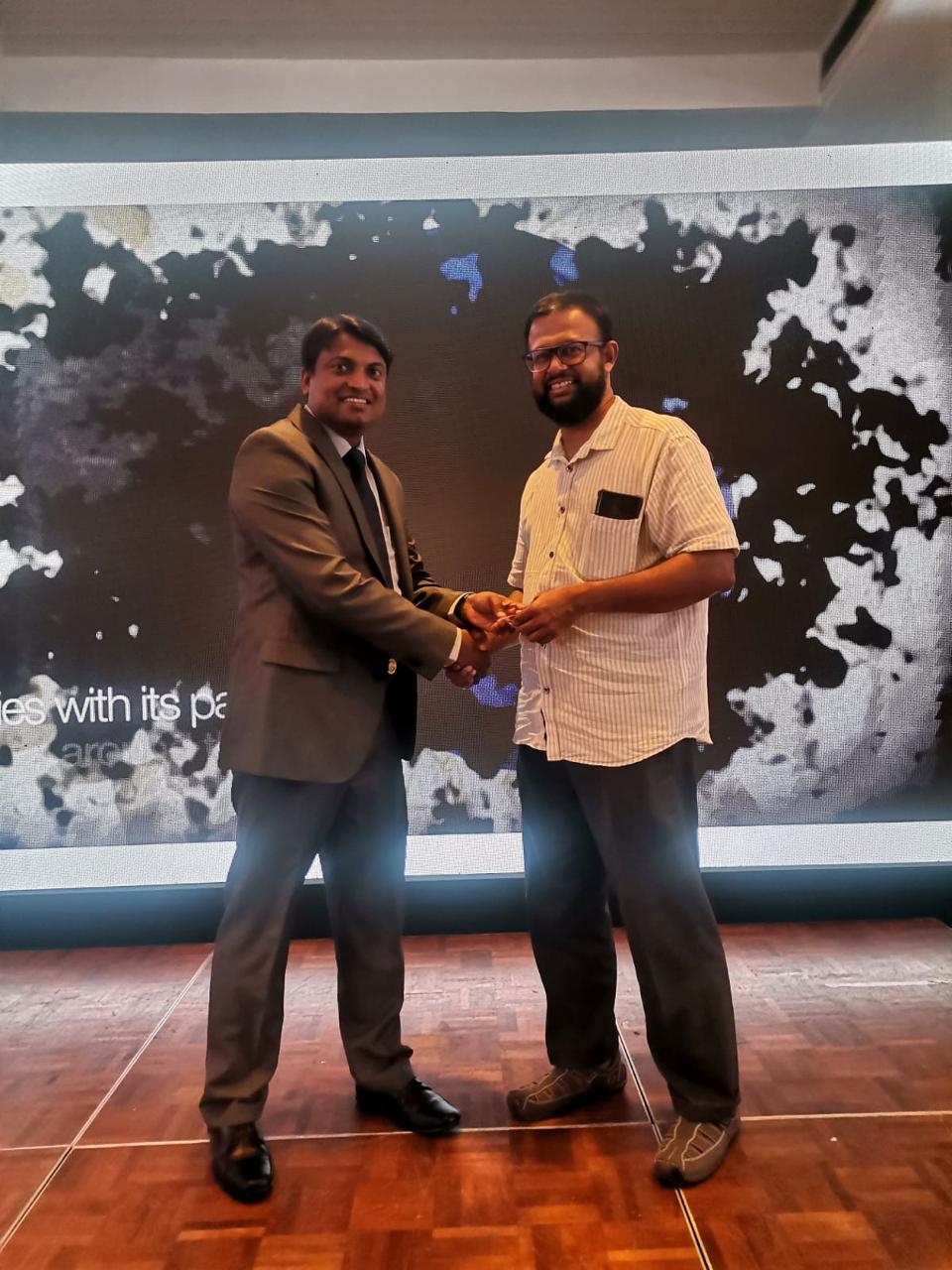 Official Gem Symposium Handshake